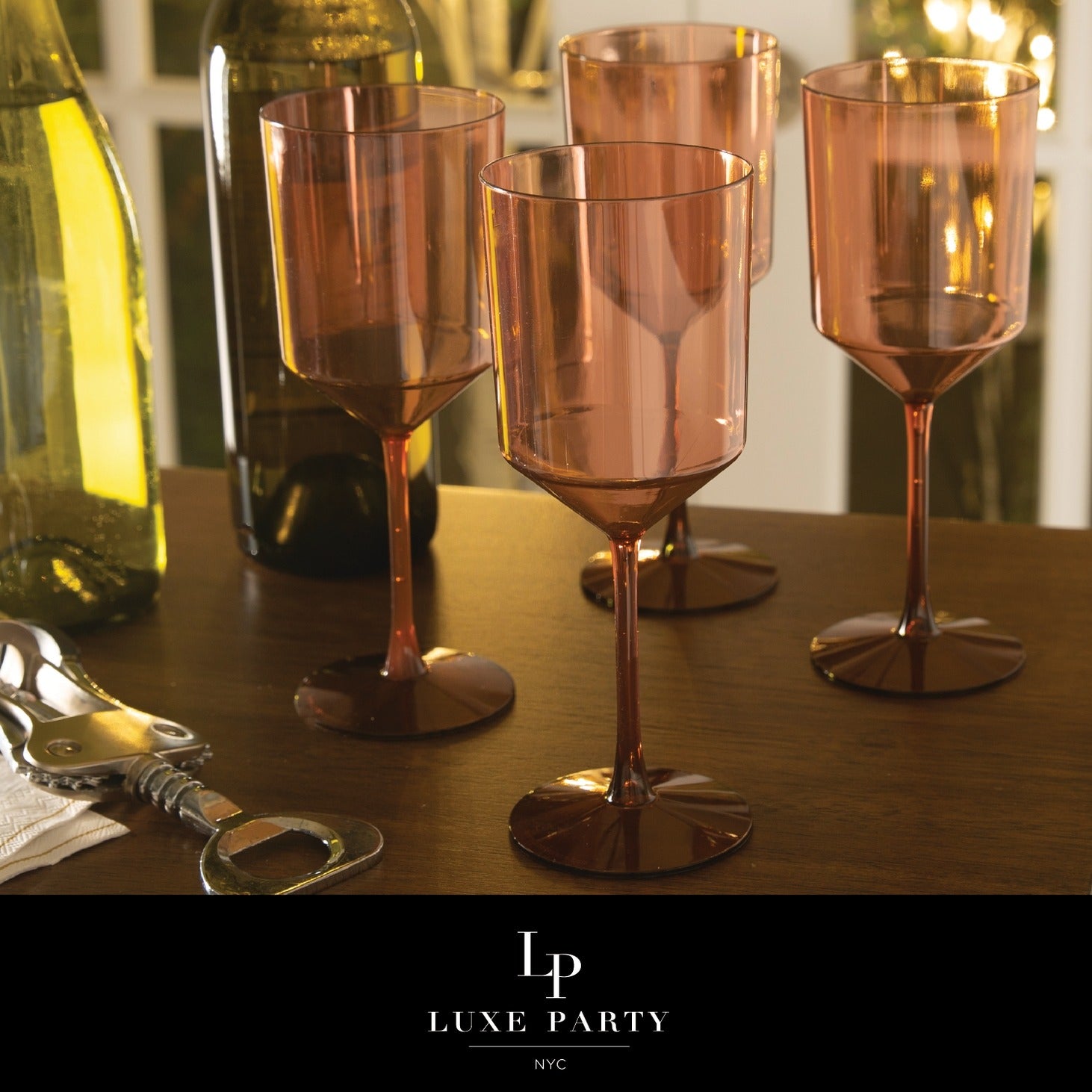 Rose gold wine glasses on wooden table elegant dinner setting from Parte Haus party supply store in Bethesda Maryland