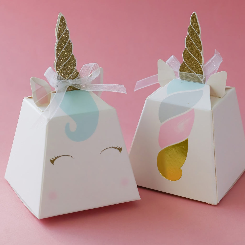 White unicorn favor boxes with gold horns pastel details and ribbons birthday theme from Parte Haus party supply store in Bethesda MD