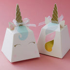 White unicorn favor boxes with gold horns pastel details and ribbons birthday theme from Parte Haus party supply store in Bethesda MD