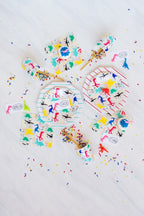 Colorful dinosaur kids tableware set with cups napkins plates for birthday theme from Parte Haus party supply store in Bethesda MD