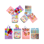 Colorful birthday gift bags with balloons and cake designs for birthday from Parte Haus party supply store in Bethesda MD