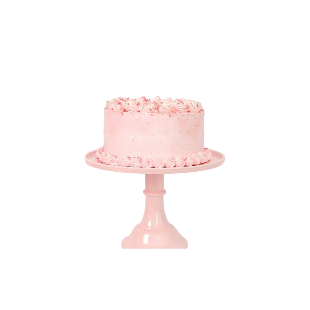 Pink cake stand with frosted round pink cake for birthday from Parte Haus party supply store in Bethesda, Maryland
