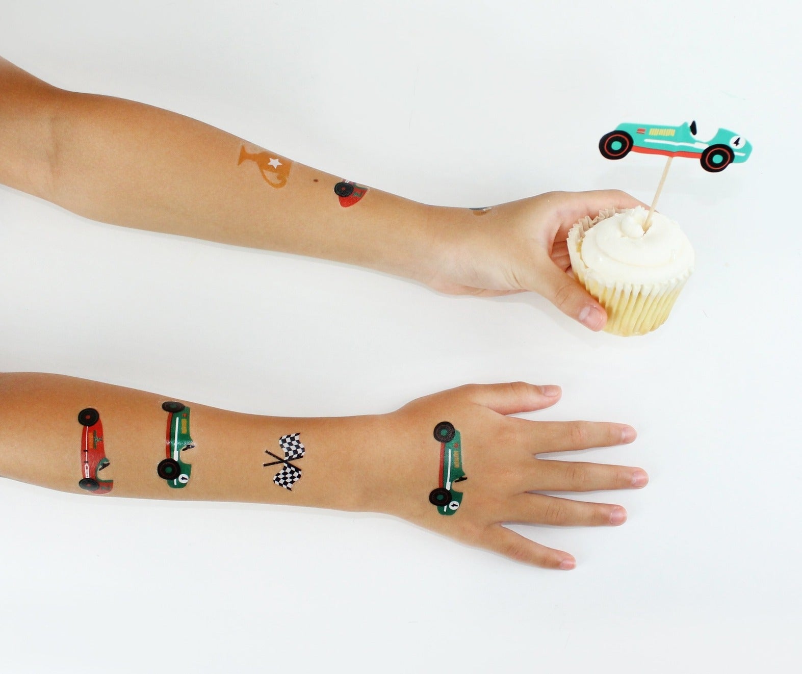 Multicolor race car temporary tattoos and race car cupcake topper for kids birthday from Parte Haus party supply store in Bethesda, Maryland.