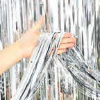 Silver fringe curtain backdrop for birthday celebration from Parte Haus party supply store in Bethesda MD