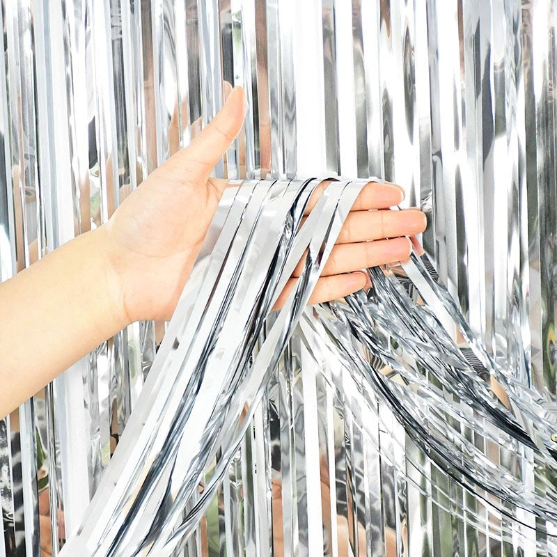 Silver fringe curtain backdrop for birthday celebration from Parte Haus party supply store in Bethesda MD