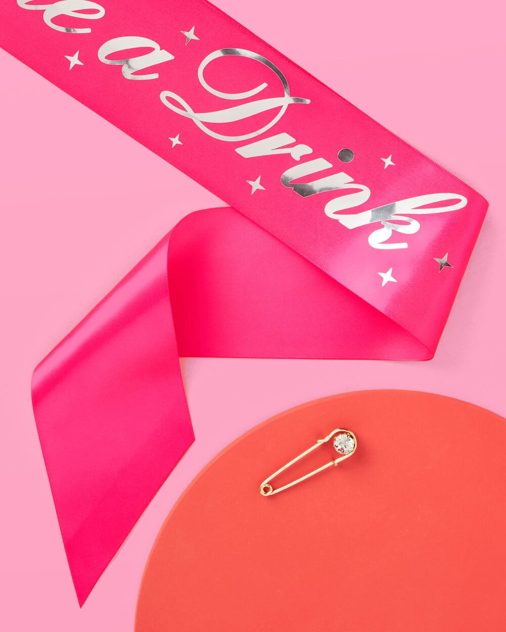 Hot pink sash with silver lettering and safety pin for bachelorette from Parte Haus party supply store in Bethesda MD