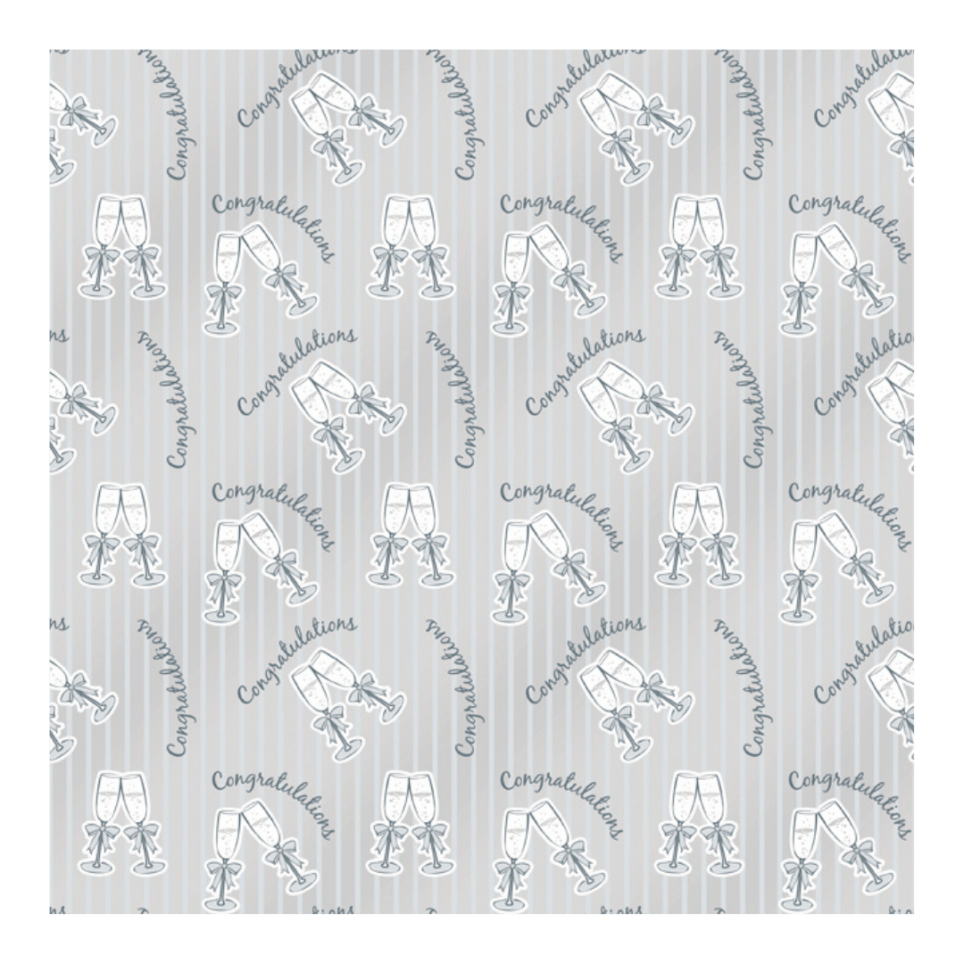 Silver congratulations gift wrap with champagne glasses for celebration from Parte Haus party supply store in Bethesda MD