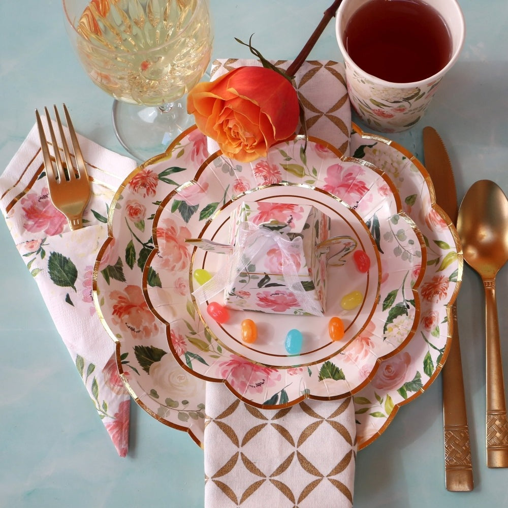 Floral pastel plates with gold trim and rose napkin tea party table setting from Parte Haus party supply store in Bethesda Maryland