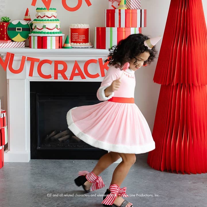 Pink and white girl dress with unicorn headband twirling for Nutcracker theme from Parte Haus party supply store in Bethesda Maryland