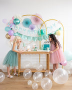 Aqua and pink birthday decoration table with balloons and two girls from Parte Haus party supply store in Bethesda MD