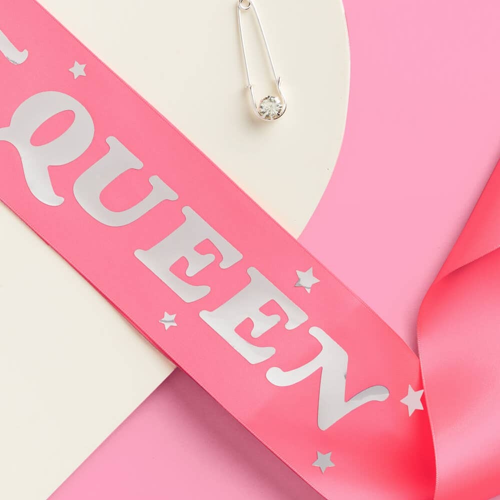 Pink queen sash with silver letters and stars for bachelorette from Parte Haus party supply store in Bethesda Maryland