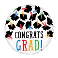 White graduation balloon with black graduation caps and colorful tassels graduation from Parte Haus party supply store in Bethesda Maryland