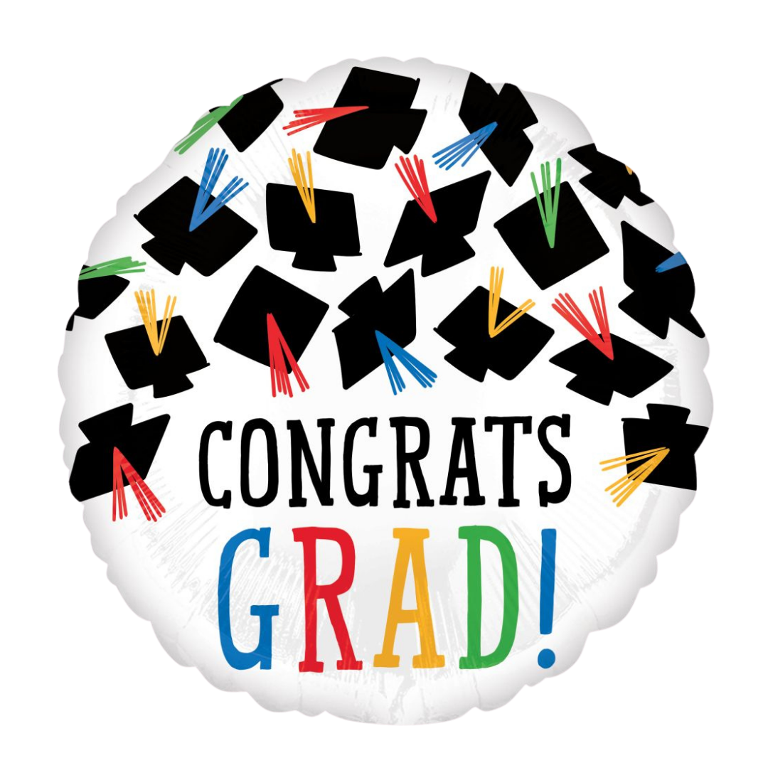 White graduation balloon with black graduation caps and colorful tassels graduation from Parte Haus party supply store in Bethesda Maryland