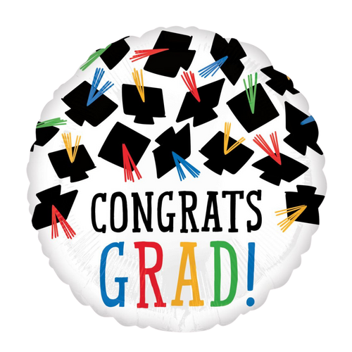 White graduation balloon with black graduation caps and colorful tassels graduation from Parte Haus party supply store in Bethesda Maryland
