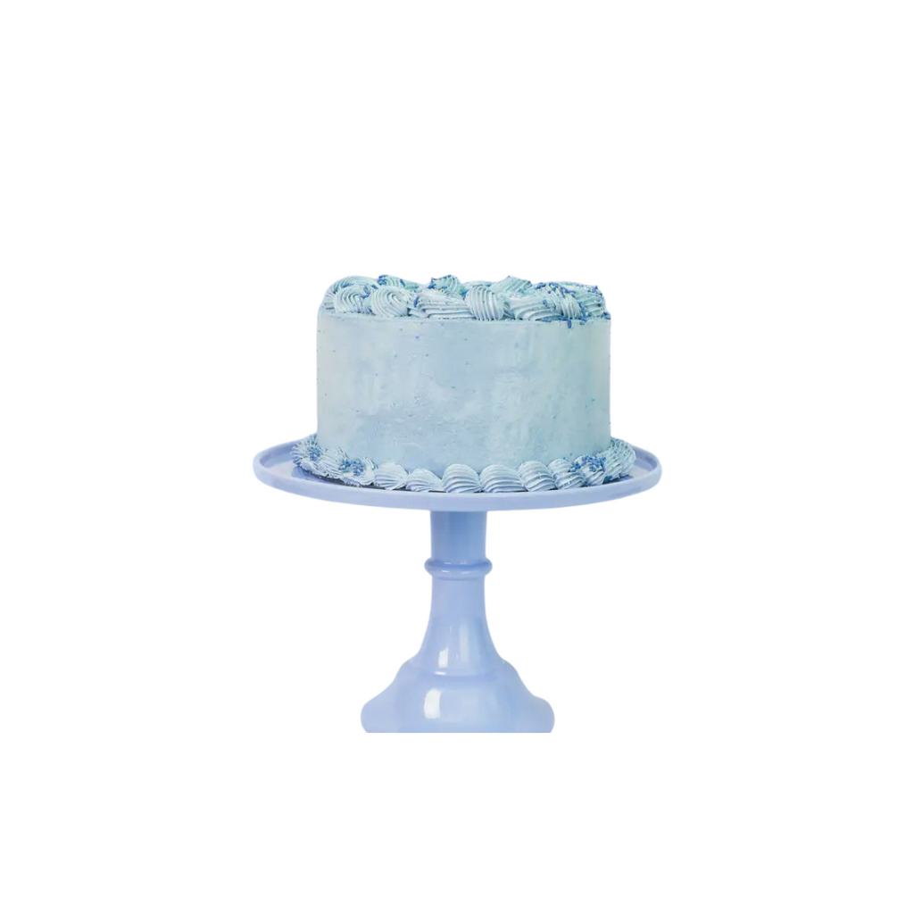 Light blue cake stand with frosted round cake for birthday celebration from Parte Haus party supply store in Bethesda MD