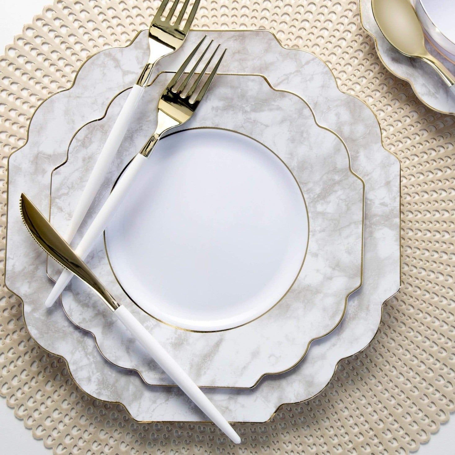 Marble gold plates with gold cutlery elegant dinnerware for celebration from Parte Haus party supply store in Bethesda MD