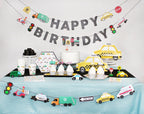 Yellow taxi car themed birthday decorations with Happy Birthday banner from Parte Haus party supply store in Bethesda Maryland