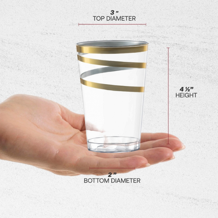 Clear gold rim plastic cup with spiral design held in hand celebration from Parte Haus party supply store in Bethesda MD