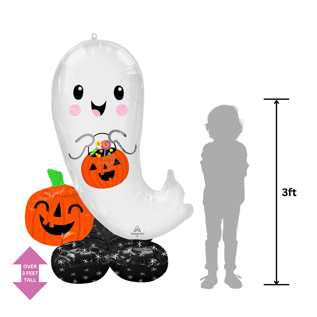 White inflatable ghost foil balloon holding a pumpkin Halloween decoration from Parte Haus party supply store in Bethesda MD