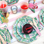 Pink and green tropical leaf plates with gold trim birthday table decor from Parte Haus party supply store in Bethesda MD