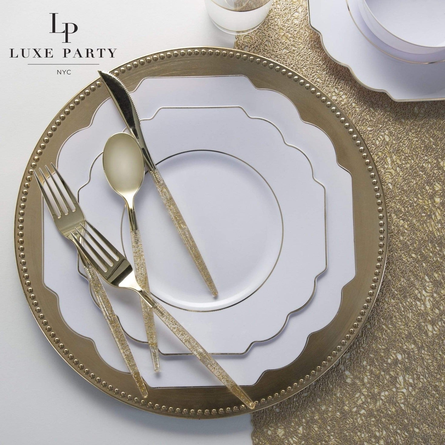 Gold and white dinnerware set with matching cutlery elegant table setting from Parte Haus party supply store in Bethesda Maryland