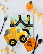 Yellow construction truck shaped plate and road map plate for construction birthday from Parte Haus party supply store in Bethesda MD