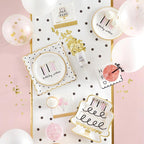 White and gold birthday tableware with polka dots cake plates and balloons birthday theme from Parte Haus party supply store in Bethesda MD