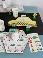 Yellow taxi car shaped plate with traffic themed decorations for kids birthday from Parte Haus party supply store in Bethesda MD