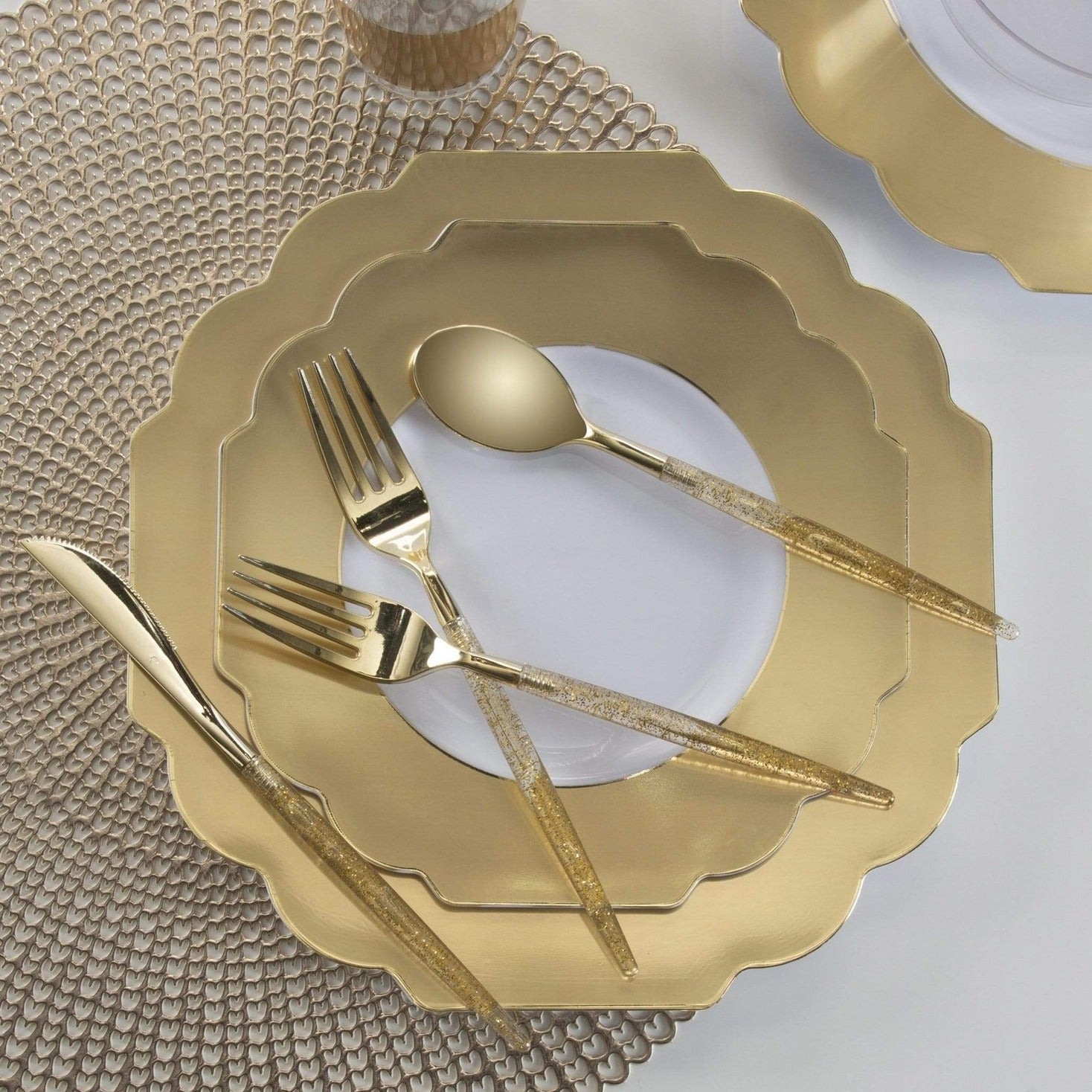 Gold plates and glitter cutlery elegant dinnerware for celebration from Parte Haus party supply store in Bethesda MD