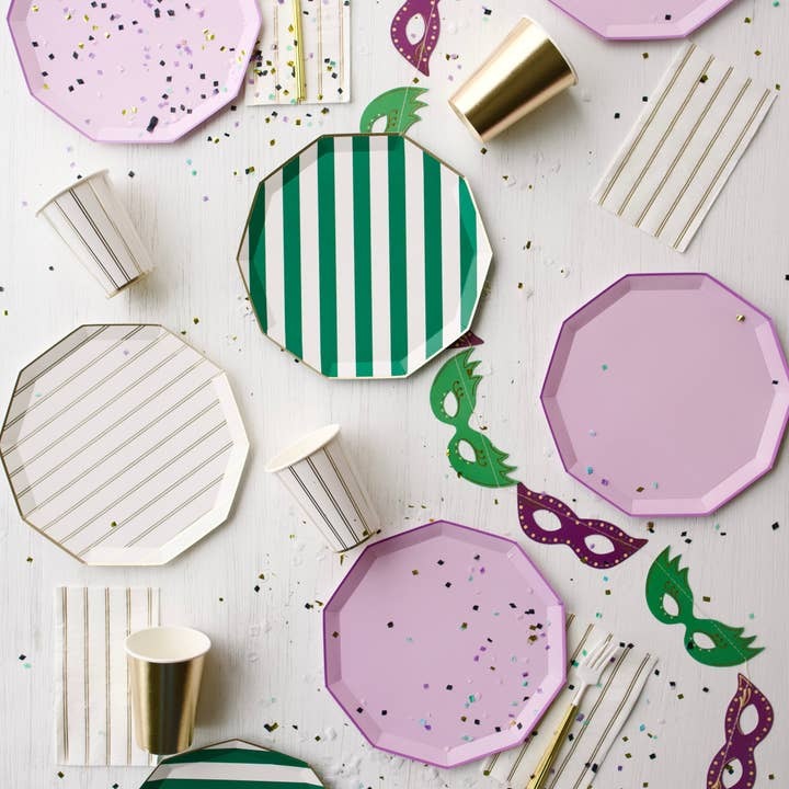Pink and green plates striped cups and confetti for masquerade theme from Parte Haus party supply store in Bethesda MD