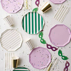 Pink and green plates striped cups and confetti for masquerade theme from Parte Haus party supply store in Bethesda MD
