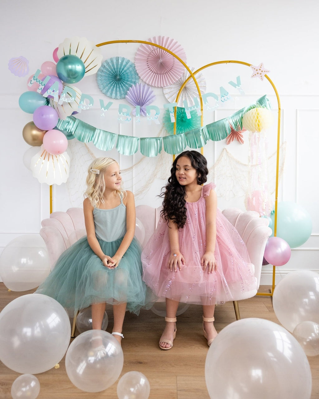 Pink and teal birthday decoration set with pastel balloons and banner kids party theme from Parte Haus party supply store in Bethesda MD