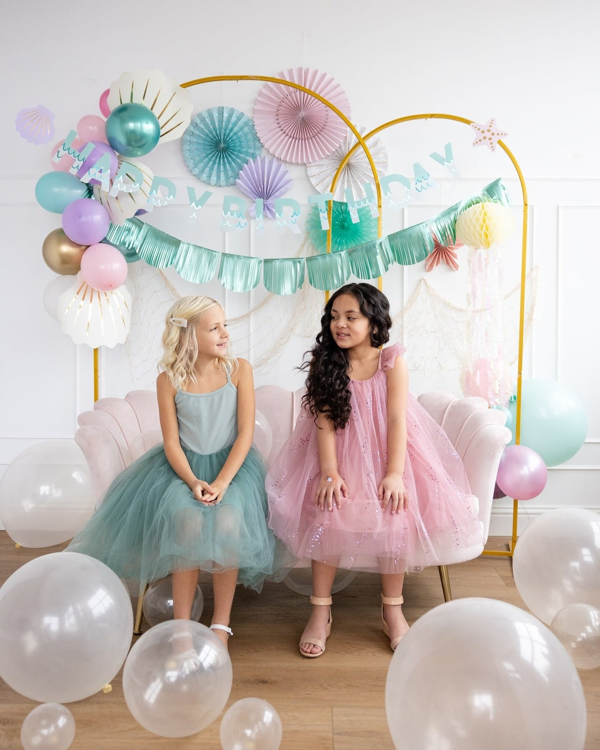Pink and teal birthday decoration set with pastel balloons and banner kids party theme from Parte Haus party supply store in Bethesda MD