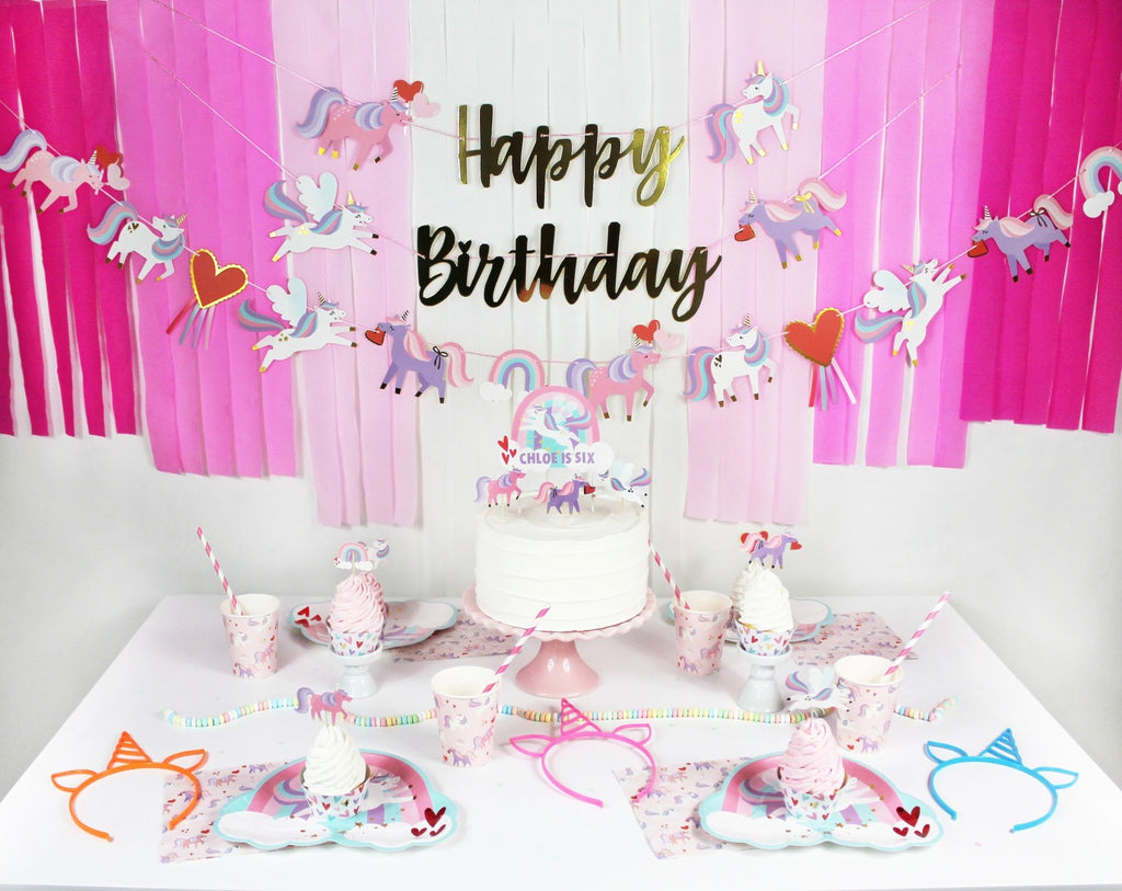 Pink unicorn birthday decoration set with cake and tableware for kids from Parte Haus party supply store in Bethesda Maryland