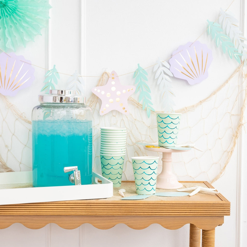Aqua blue drink dispenser mermaid paper cups beach theme from Parte Haus party supply store in Bethesda MD