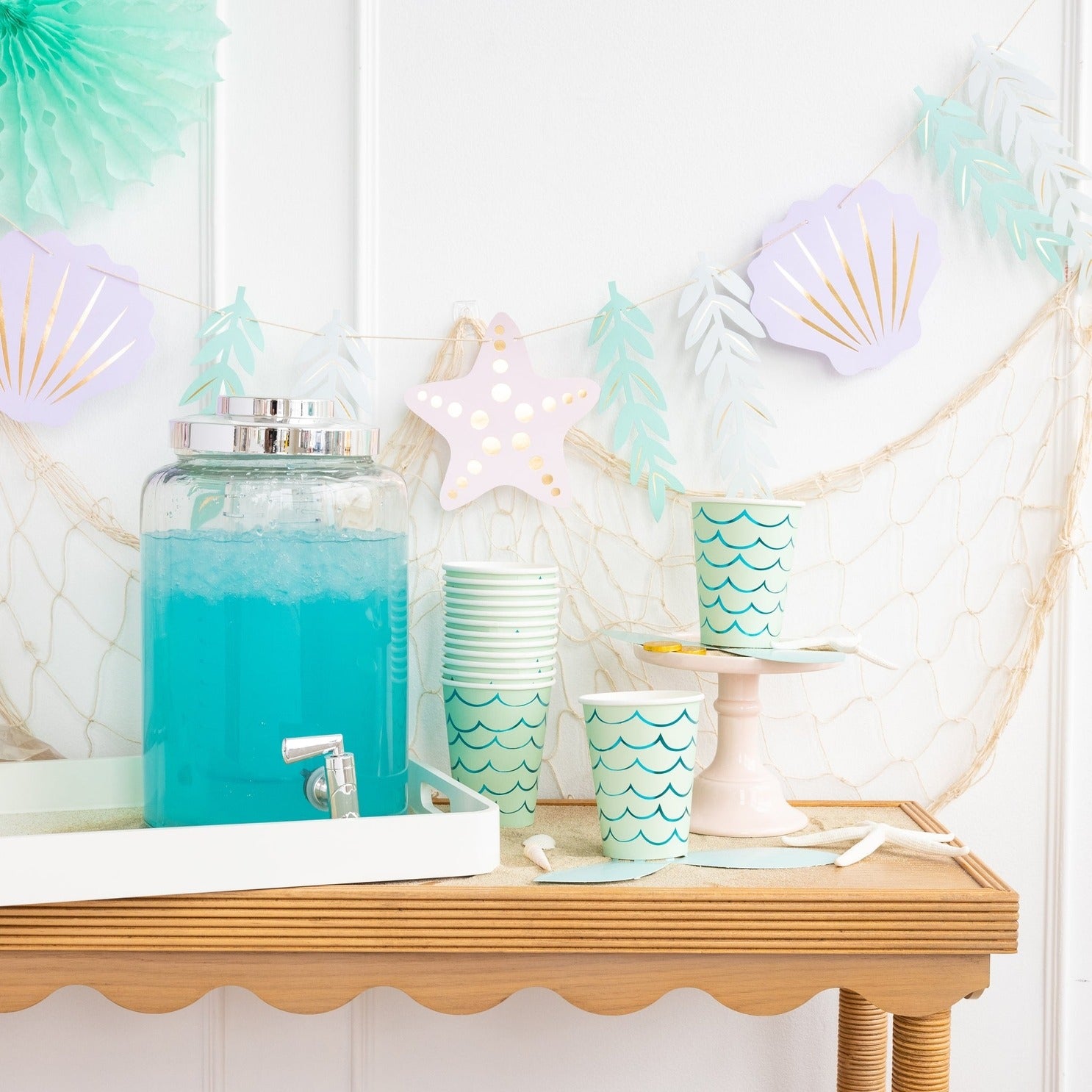 Aqua blue drink dispenser mermaid paper cups beach theme from Parte Haus party supply store in Bethesda MD