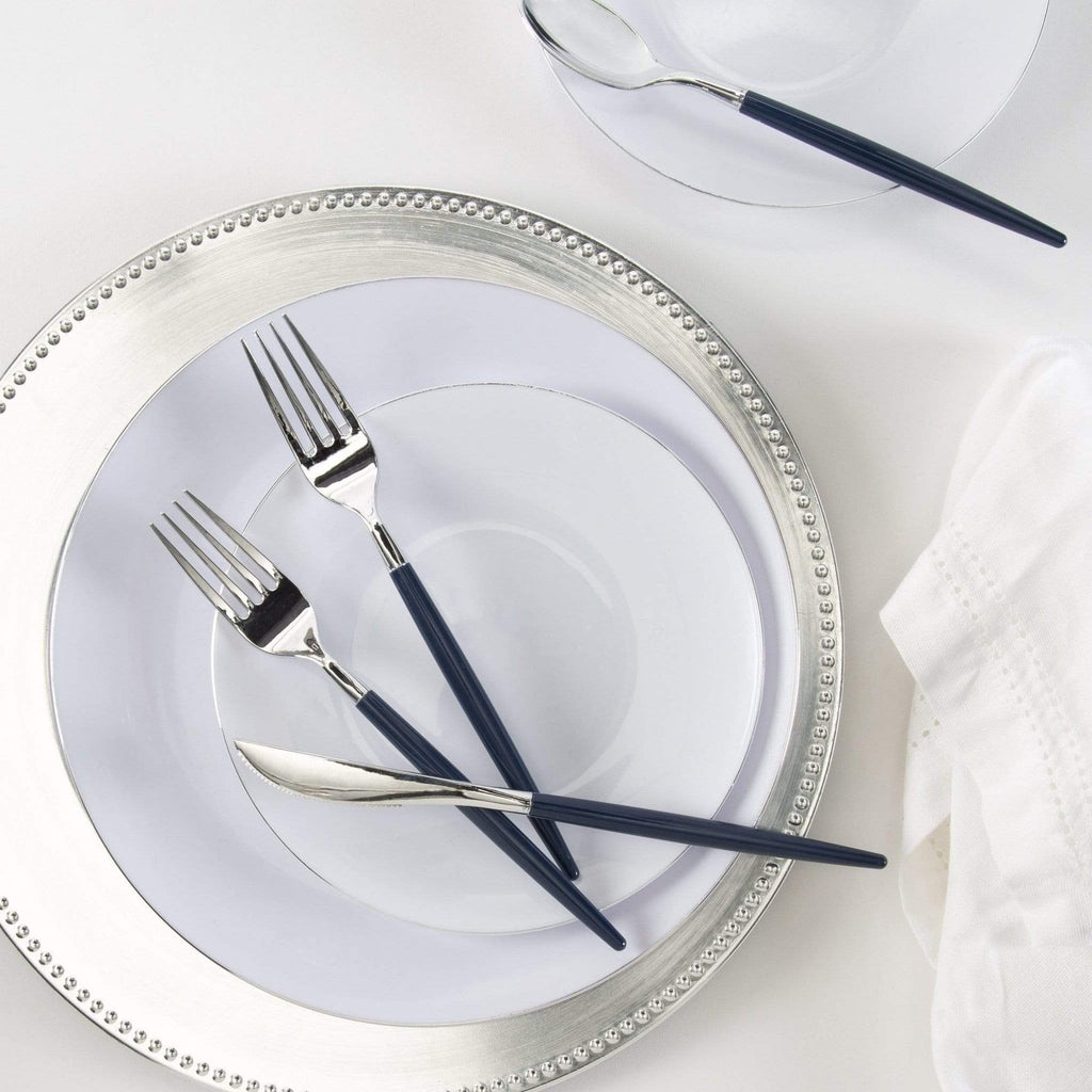 Silver navy blue flatware and white dinner plates elegant table setting from Parte Haus party supply store in Bethesda MD