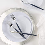 Silver navy blue flatware and white dinner plates elegant table setting from Parte Haus party supply store in Bethesda MD
