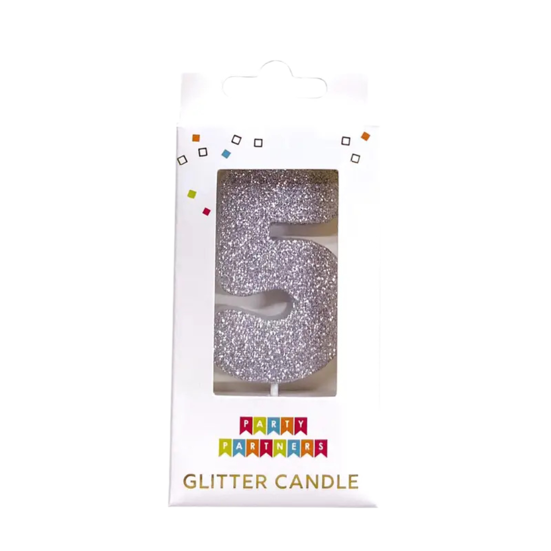 Silver glitter number 5 birthday candle in packaging from Parte Haus party supply store in Bethesda Maryland