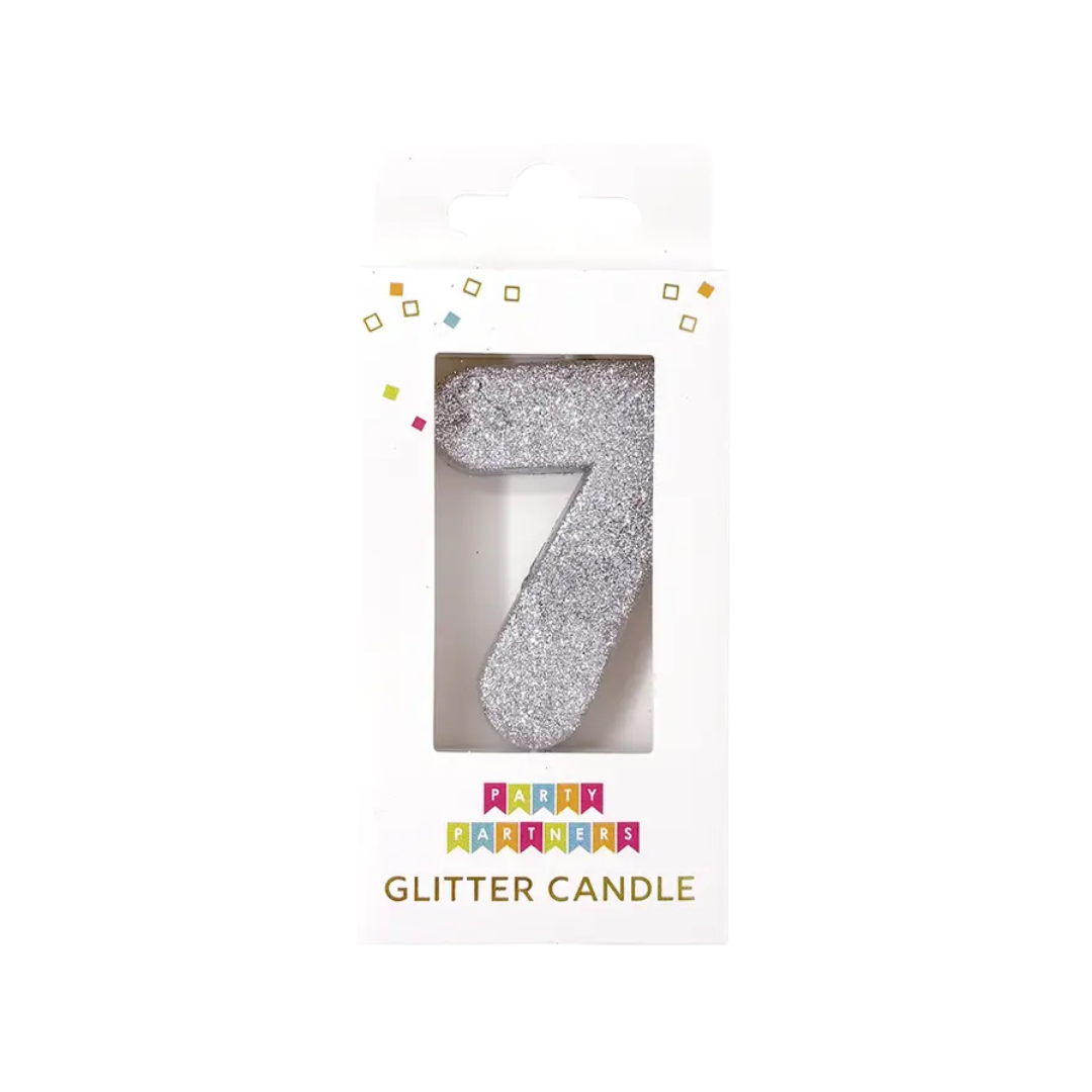 Silver number seven glitter candle in packaging for birthday from Parte Haus party supply store in Bethesda Maryland