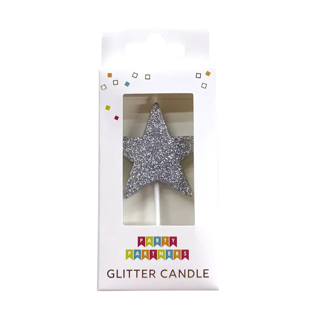 Silver glitter star candle in packaging for birthday from Parte Haus party supply store in Bethesda Maryland