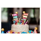 Colorful birthday cake with candles and candy decorations birthday theme from Parte Haus party supply store in Bethesda MD
