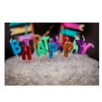 multicolor glitter birthday candles on white coconut cake birthday theme from Parte Haus party supply store in Bethesda Maryland