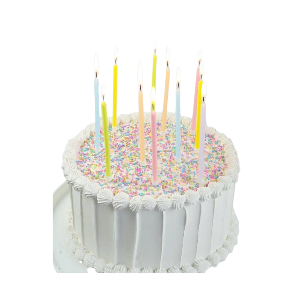 Pastel birthday candles on white frosted cake with rainbow sprinkles birthday theme from Parte Haus party supply store in Bethesda Maryland
