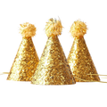 Gold glitter cone hats with fluffy tops birthday celebration from Parte Haus party supply store in Bethesda MD.