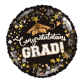 Black and gold graduation balloon with cap stars and congratulations grad text from Parte Haus party supply store in Bethesda Maryland