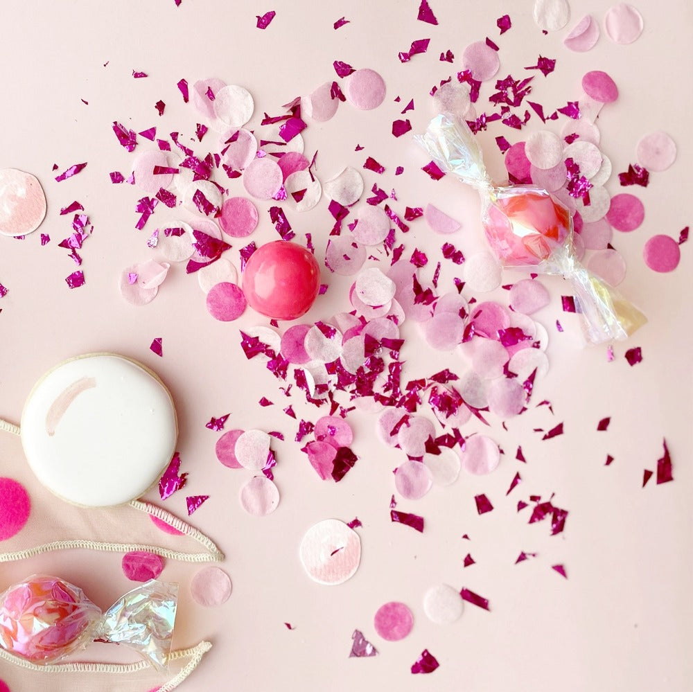 Pink and white confetti with candy and cookie celebration decor for birthday from Parte Haus party supply store in Bethesda MD