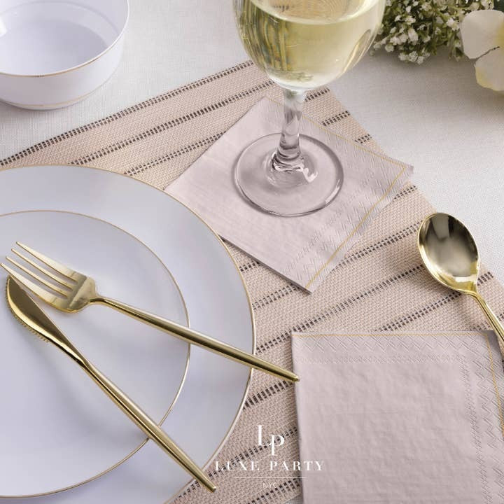 White and gold plates and silverware elegant table setting for celebration from Parte Haus party supply store in Bethesda MD