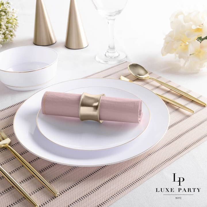 Pink and gold table setting with napkin on white plates elegant dinner theme from Parte Haus party supply store in Bethesda MD
