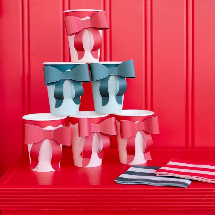 Red and blue ballet slipper cups with bows stacked for ballet birthday from Parte Haus party supply store in Bethesda MD